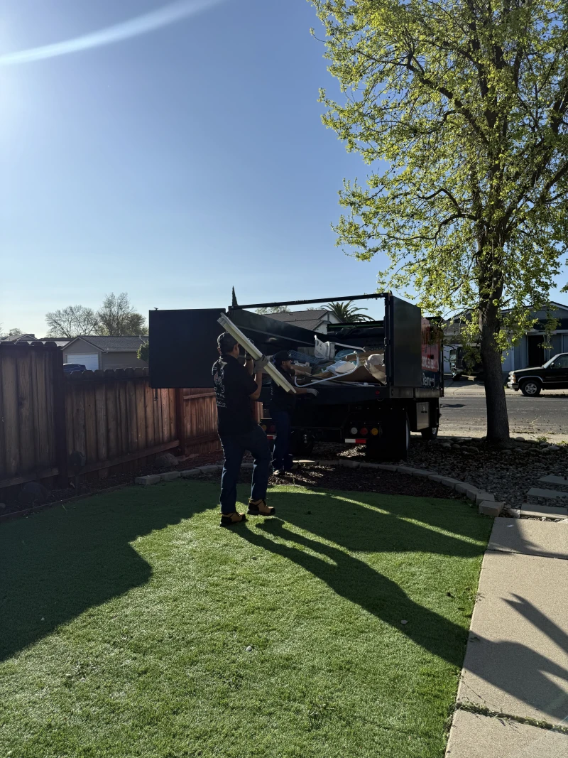 ScanJunk dump truck loaded with wood debris for hauling