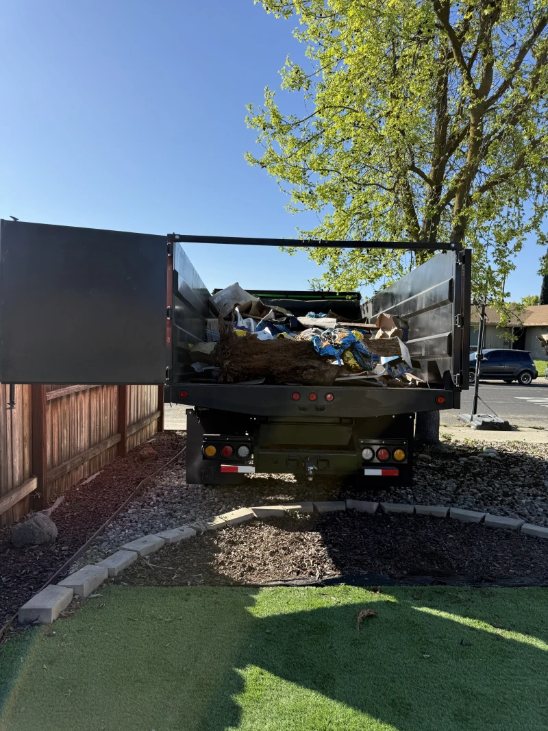 ScanJunk junk removal truck half-loaded in Stockton neighborhood