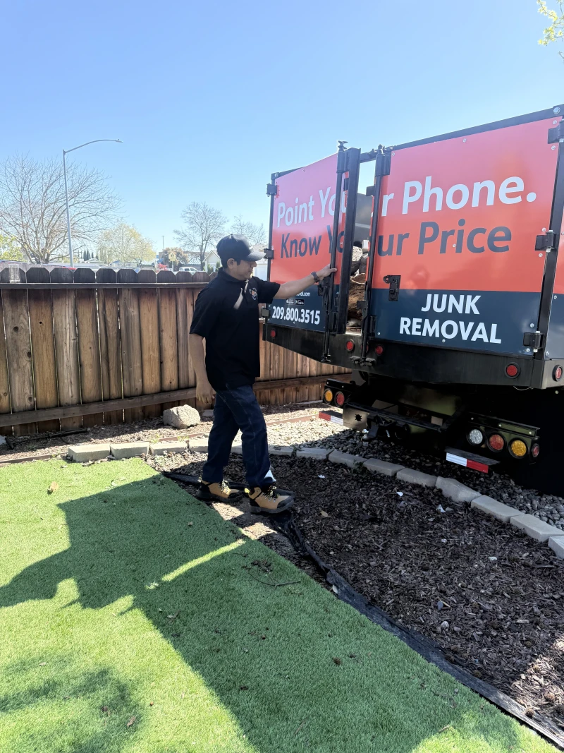 ScanJunk truck with full load of debris branding visible