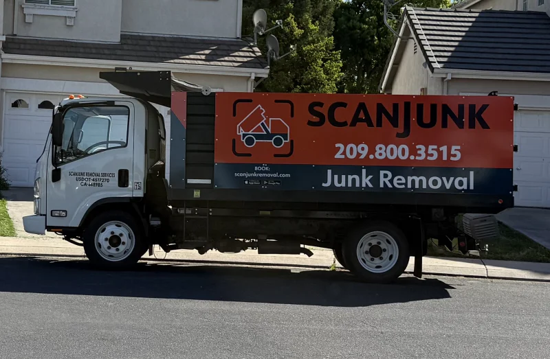 ScanJunk Removal 14ft junk removal truck fully loaded after a garage cleanout