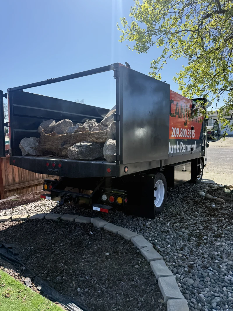 ScanJunk branded truck loaded with heavy logs for hauling