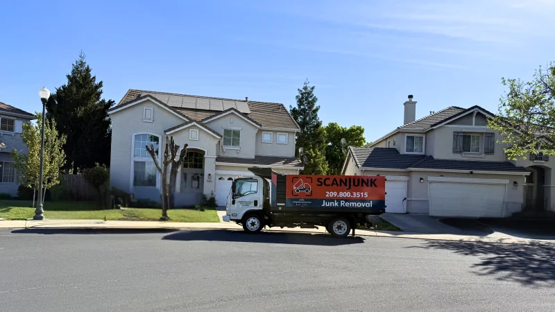 ScanJunk 14ft junk removal truck parked in a residential neighborhood